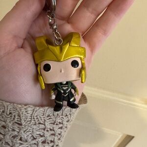 Gold and Black Keychain Figure